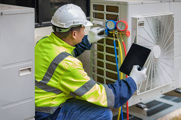 Professional Hvac technician working in Bay Minette, AL